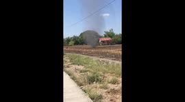 Dust devil tornado whips across dried field in the Philippines