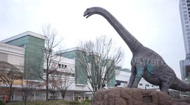 Japanese train station where passengers are greeted by 'living' dinosaurs