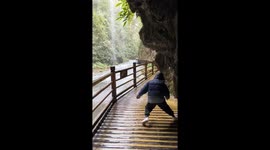 Unexpected obstacles: child's tumble amidst scenic walk