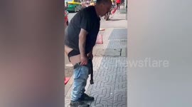 Middle-aged tourist strips off and bathes in Buddhist shrine in Thailand