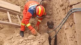 Chinese firefighters save elderly villager trapped under collapsed wall during home renovation