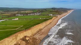Walkers and fossil hunters ignoring warnings to stay clar of the huge cliff rockfall at Hive Beach at Burton Bradstock in Dorset.