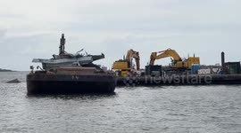 Contractors clear debris from Baltimore bridge collapse