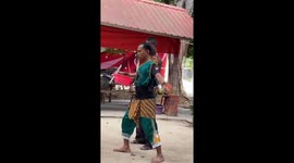 The men use their mouths to chew glass, eat fire, and peel coconuts