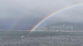 A beautiful full rainbow on Loch Long in Argyll on the West Coast of Scotland