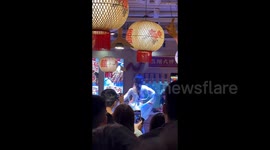 Chinese restaurant owner draws crowds with traditional moves