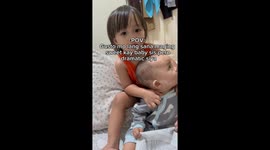 Sibling's play turns pushy: 2-year-old's reaction to baby's tears caught on video