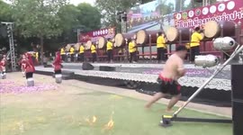 Fire breather accidentally burns himself during performance