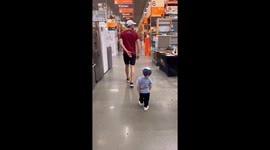 Son mimics dad's every move in the display of hero worship at Home Depot