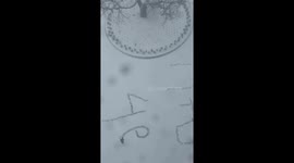 Heartwarming scene as walker tramples romantic message in snow