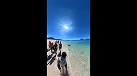 Walk through this crystal-clear beach in the Philippines