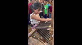 Schoolgirl, 8, shows off her weaving skills with ancient wooden frame