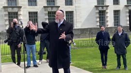 “Our hearts are broken”. UK Chief Rabbi Ephraim Mirvis delivers a speech next to an empty Seder table outside Downing St