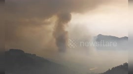 Firefighters battle to contain wildfire burning in eastern Spain