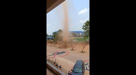 Dust devil tornado tears through school field