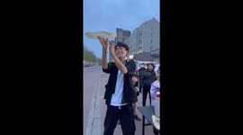 Vendor mastering art of dough throwing wows onlookers
