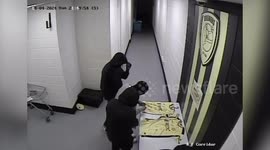 Masked gang caught on CCTV raiding UK football club and signing shirt