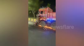 Motorist clings onto lorry door as speeding vehicle drags his motorcycle