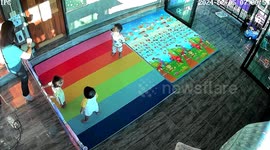 Clumsy mum trips over play pen plastic fence