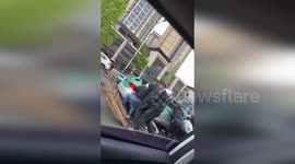 Morning commuters rush to lift taxi off crushed woman