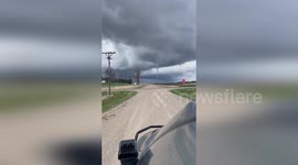 Twister moves across horizon during storm in Iowa