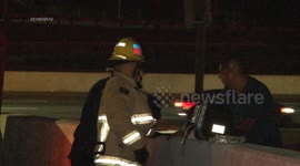Firefighters attend scene of overturned semi truck in Los Angeles