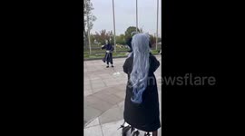 China: Cosplayer Wows Crowd with Fireball Performance