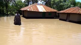 Flash floods kill at least 13 people and displace nearly 15,000 others in Kenya