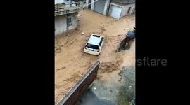 Torrential rains submerge streets and sweep away vehicles in southern China