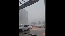 Dubai floods force pedestrians to wade through water amidst transportation shutdown