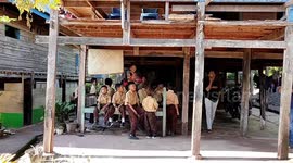 Elementary School Students In Enrekang, South Sulawesi, Indonesia Study Under The House