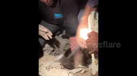 Rescue teams pull out a wounded little girl following an Israeli strike on eastern Rafah