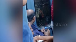 Furious train passenger smashes glass window when he misses departure
