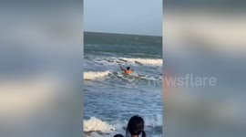 Hero beachgoers rescue boy drowning at sea in Thailand