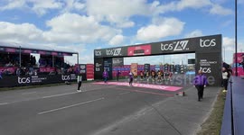 Elite Women Runners nearly get hit by a part of the starting line structure