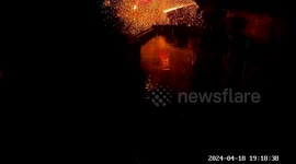 Terrifying lightning strike hits house roof, sending sparks flying across the sky in China