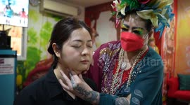 Eccentric Thai woman gives 'face slapping therapy' sessions