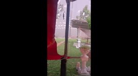 Summer storm batters family's home garden in Thailand