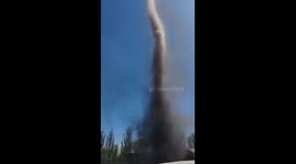 Drivers shocked when dust devil tornado appears in car park