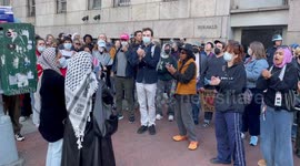 Pro-Palestinian demonstrators chant “shut it down” outside Columbia University gates