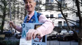 MARK CRAWFORD LOVETT Plays Patriotic Music on His Flute outside Criminal Court in New York