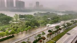 Truck plows through floodwaters, drenching vehicles in rain-soaked Guangdong