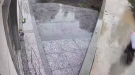 Biker sinks in drainage ditch after becoming trapped in floodwater