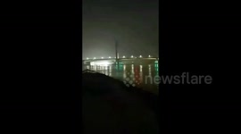 Four missing after ship collides with bridge and sinks in China
