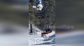 USA: April Snow Blankets California, Impeding Road Travel