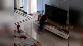 TV falls on toddler's head while he's looking for toys