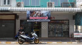 Angry locals put up banners in protest at monkeys in Lopburi, Thailand