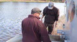 USA: U.S. Fish and Wildlife Service fish hatchery personnel stock fish at Fort McCoy 2