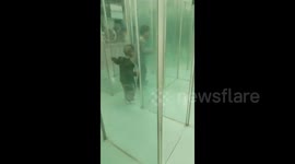 China: Child's adventures in glass maze in Henan