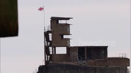 No 1 The Thames flies St. George's Day flag off Kent, UK
